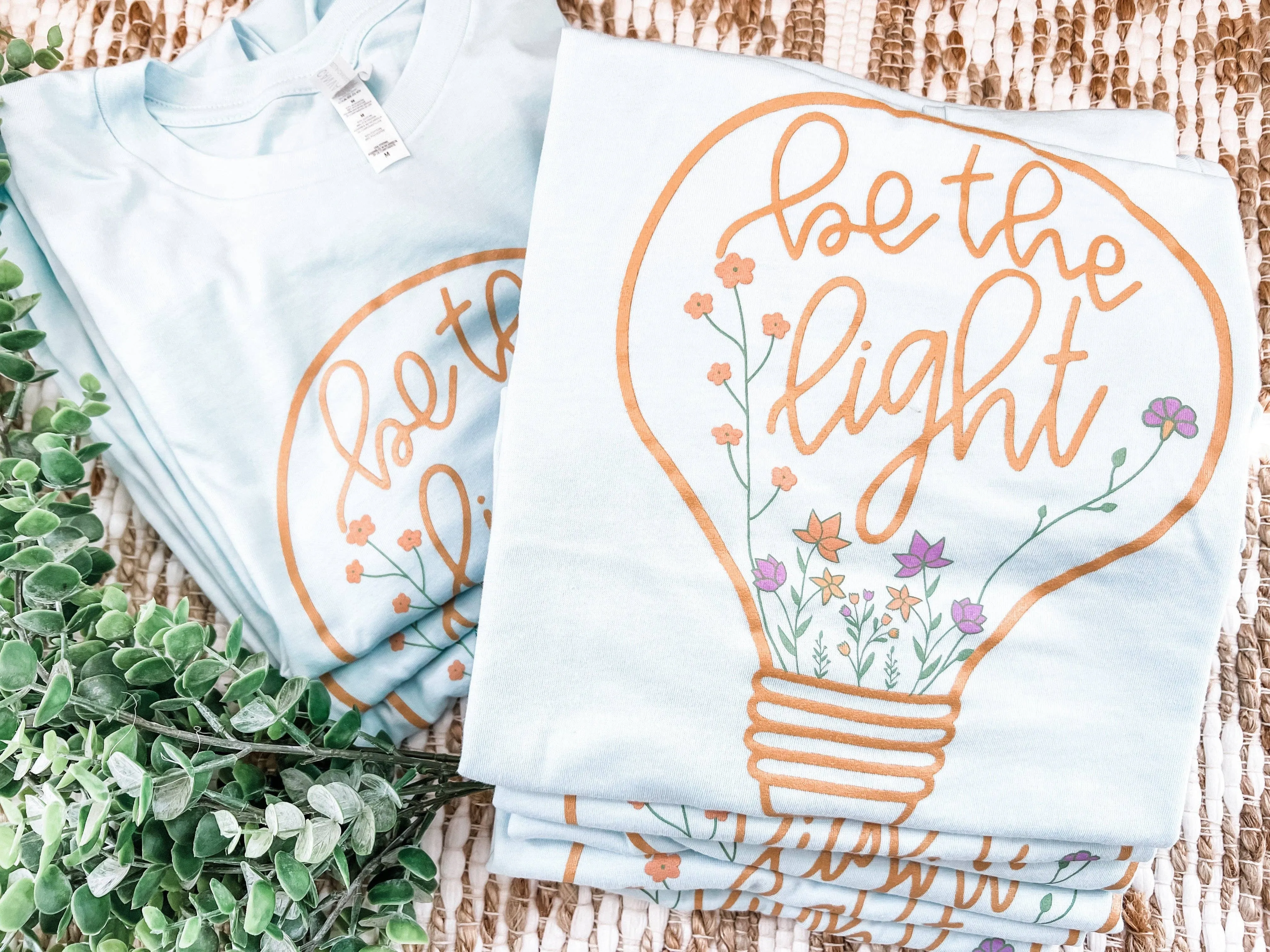 BE THE LIGHT | HEATHER ICE BLUE | GRAPHIC TEE SHORT SLEEVE