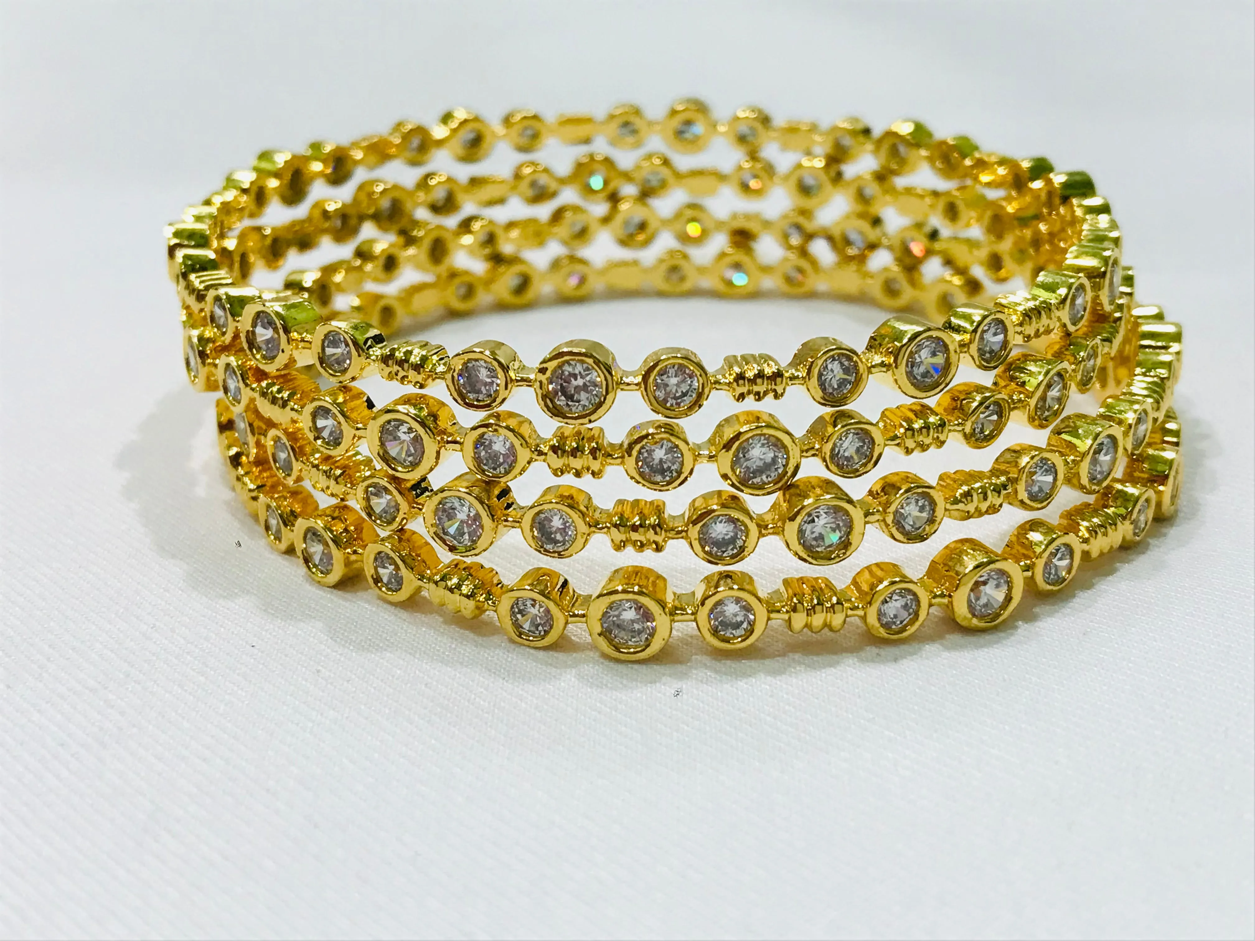 Dazzling Gold Plated Antique Bangles With Silver Stones