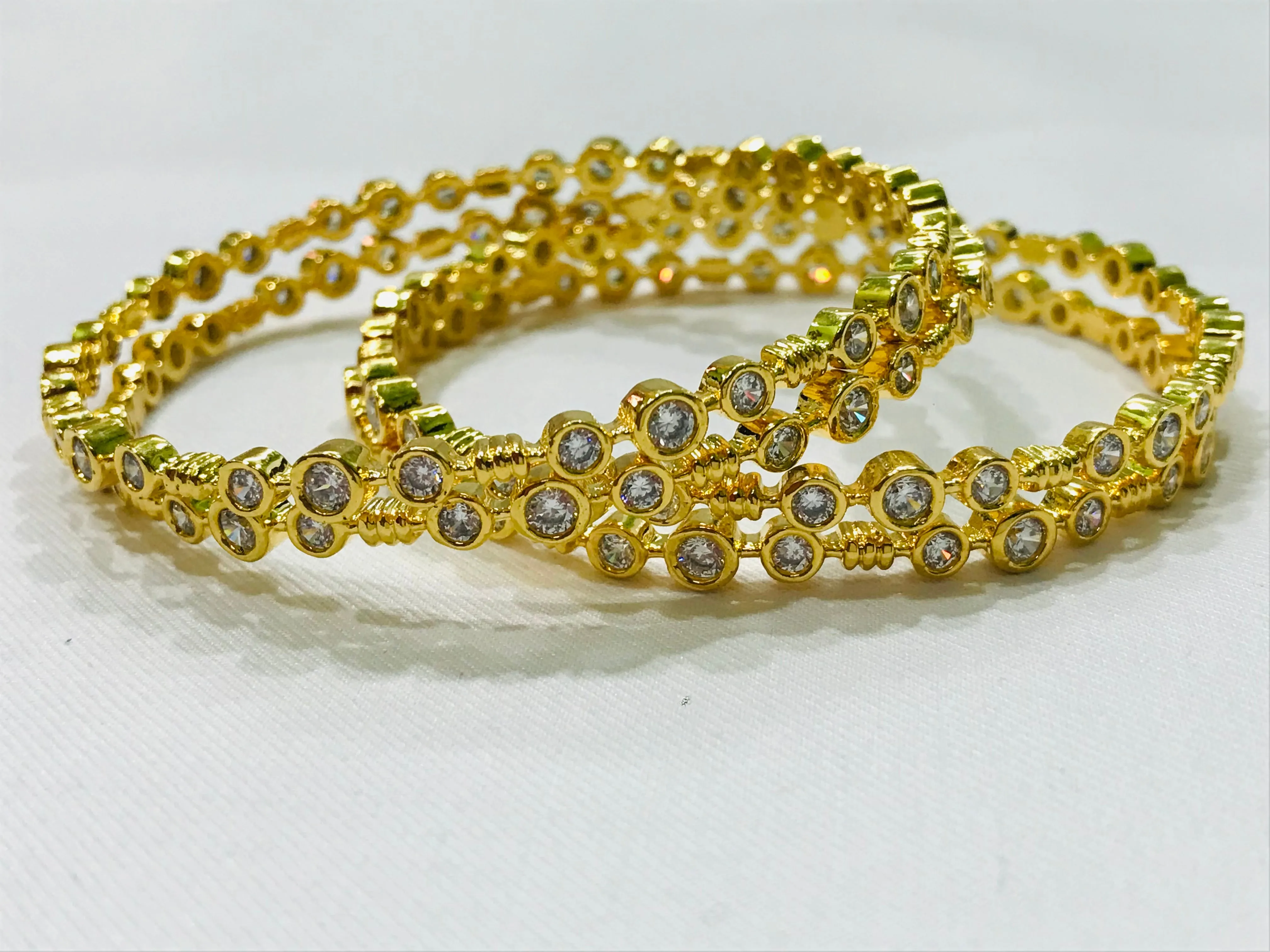 Dazzling Gold Plated Antique Bangles With Silver Stones